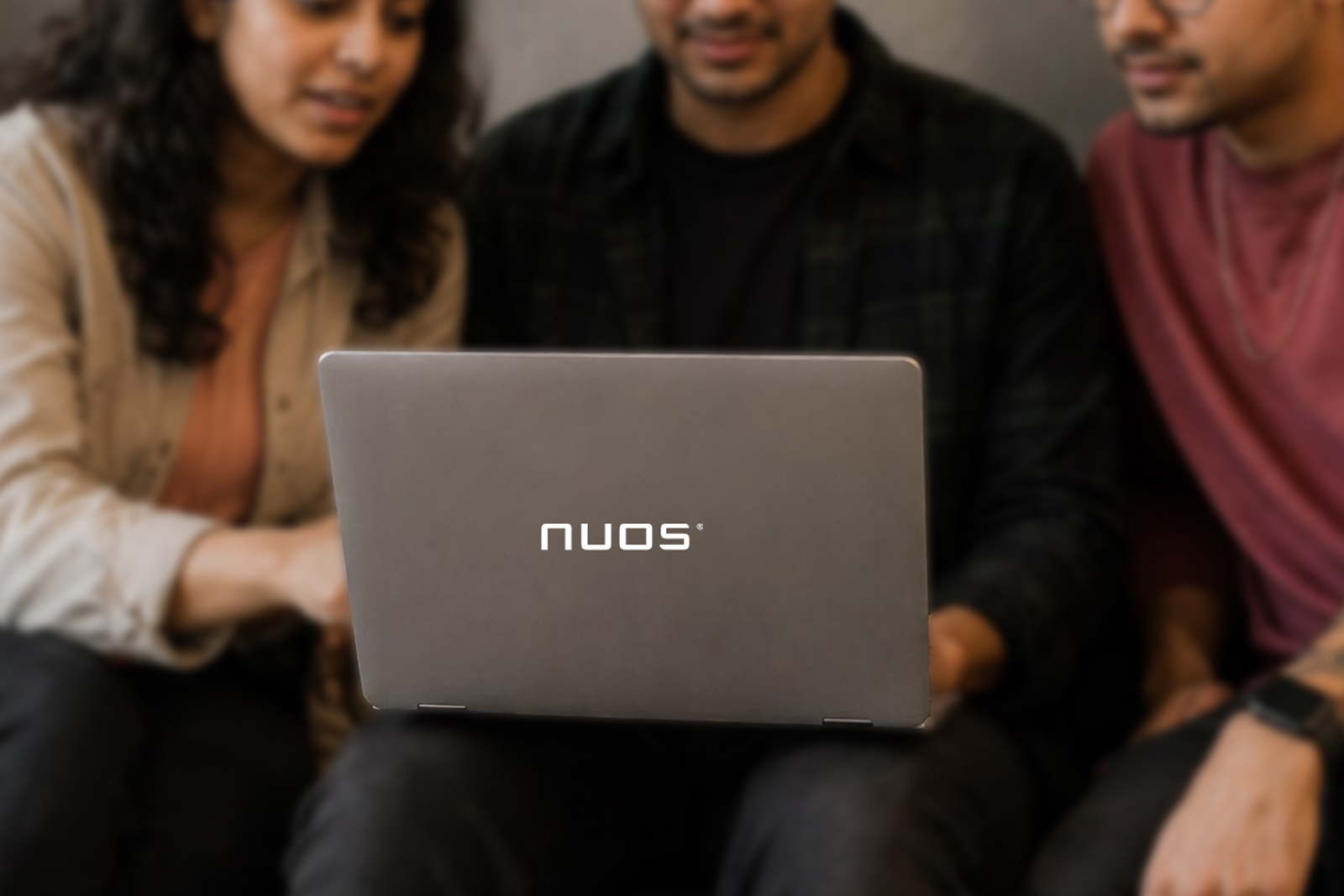 NUOS engineering team collaborating in the office, prototyping and reviewing electronics designs together